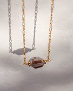 A gold Barely There Gemstone Necklace with a coffee moonstone pendant