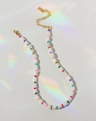 Necklace with colorful beads on a white background