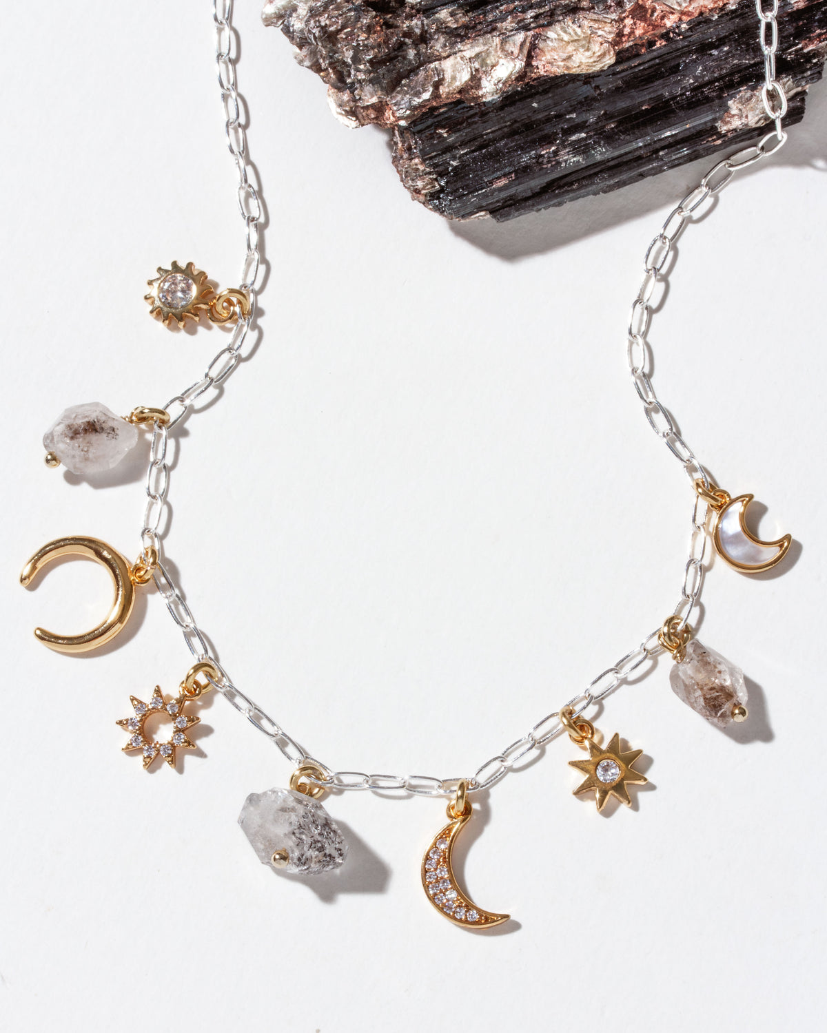 Herkimer Horizon charm necklace, with silver chain, and Herkimer quartz and sun and moon charms.