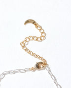 Close-up of the Herkimer Horizon Charm Necklace's clasp and gold extender chain