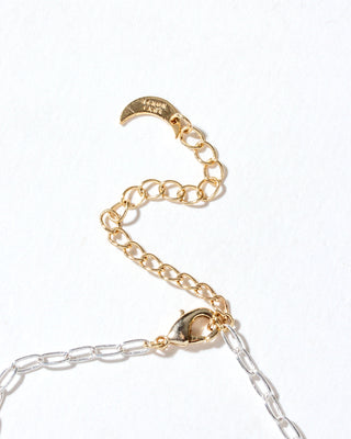 Close-up of the Herkimer Horizon Charm Necklace's clasp and gold extender chain, showing the transition to silver paperclip links.