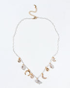 Herkimer Horizon Charm Necklace with silver chain with gold celestial charms and Herkimer quartz.