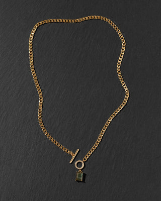 A gold-toned chain necklace with a toggle clasp and a small labradorite hanging pendant.
