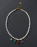 Pearl necklace with colorful gemstone charms in many shapes, with gold-plated lobster closure