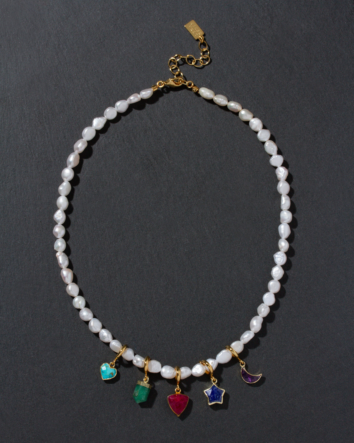 Pearl necklace with colorful gemstone charms in many shapes, with gold-plated lobster closure