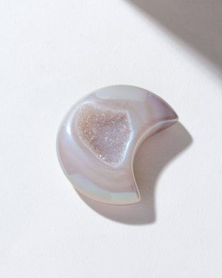 Bright colored druzy agate moon shaped gemstone curio.