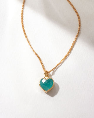 Amazonite heart pendant necklace with gold chain on a white background.