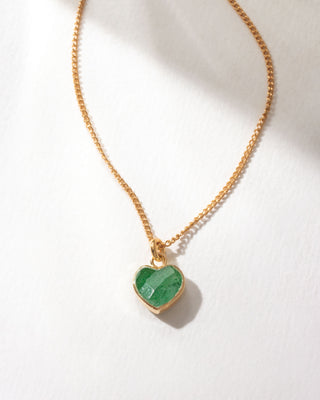 Gold necklace with a green aventurine heart-shaped pendant on a white background