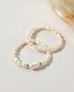 Two Coastal Stretch Rings, one with a Freshwater Pearl.