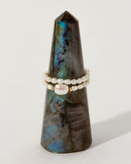 Freshwater Pearl Coastal Stretch Ring Set on a Labradorite tower.