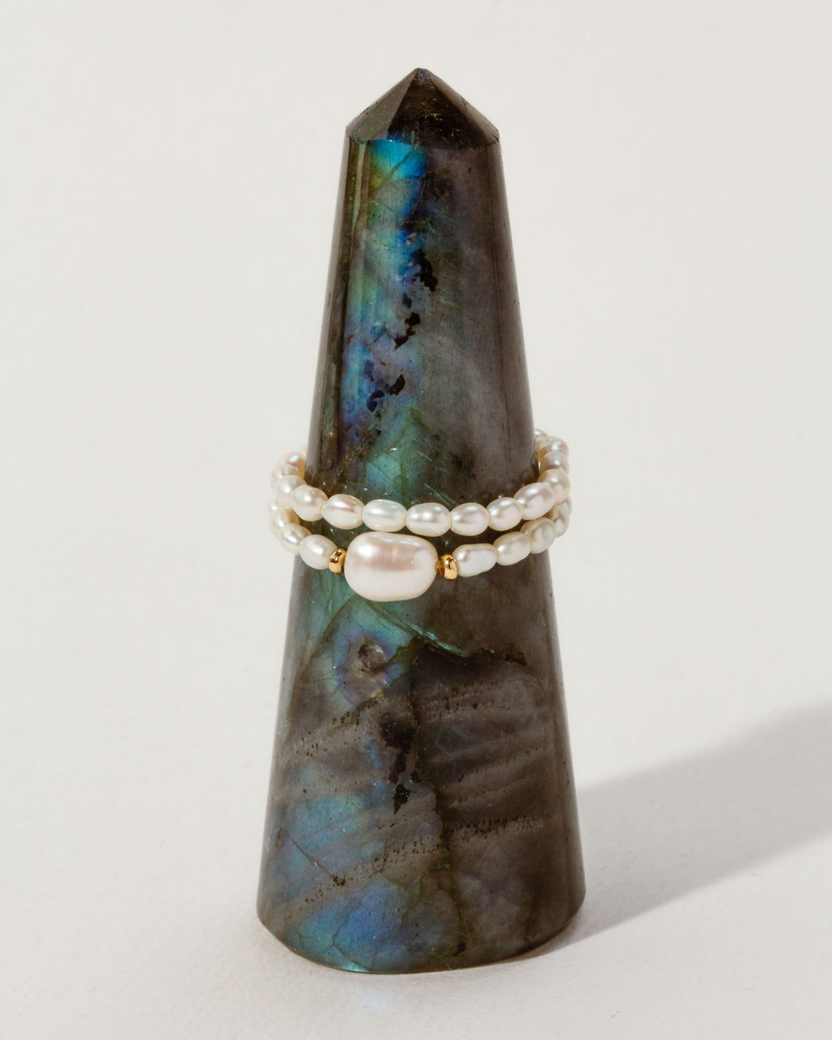 Freshwater Pearl Coastal Stretch Ring Set on a Labradorite tower.