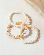 Three pearl and Peruvian Opal "Change Of Tides Stretch Ring" sets.