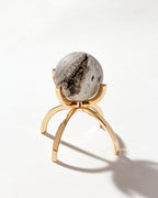 Silver Eye of the Beholder Druzy Gemstone Sphere on a Gold stand.