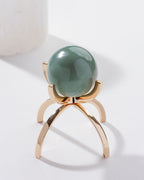 Eye Of the Beholder Gemstone Sphere On Stand Set, with a Green Aventurine sphere on a gold stand.