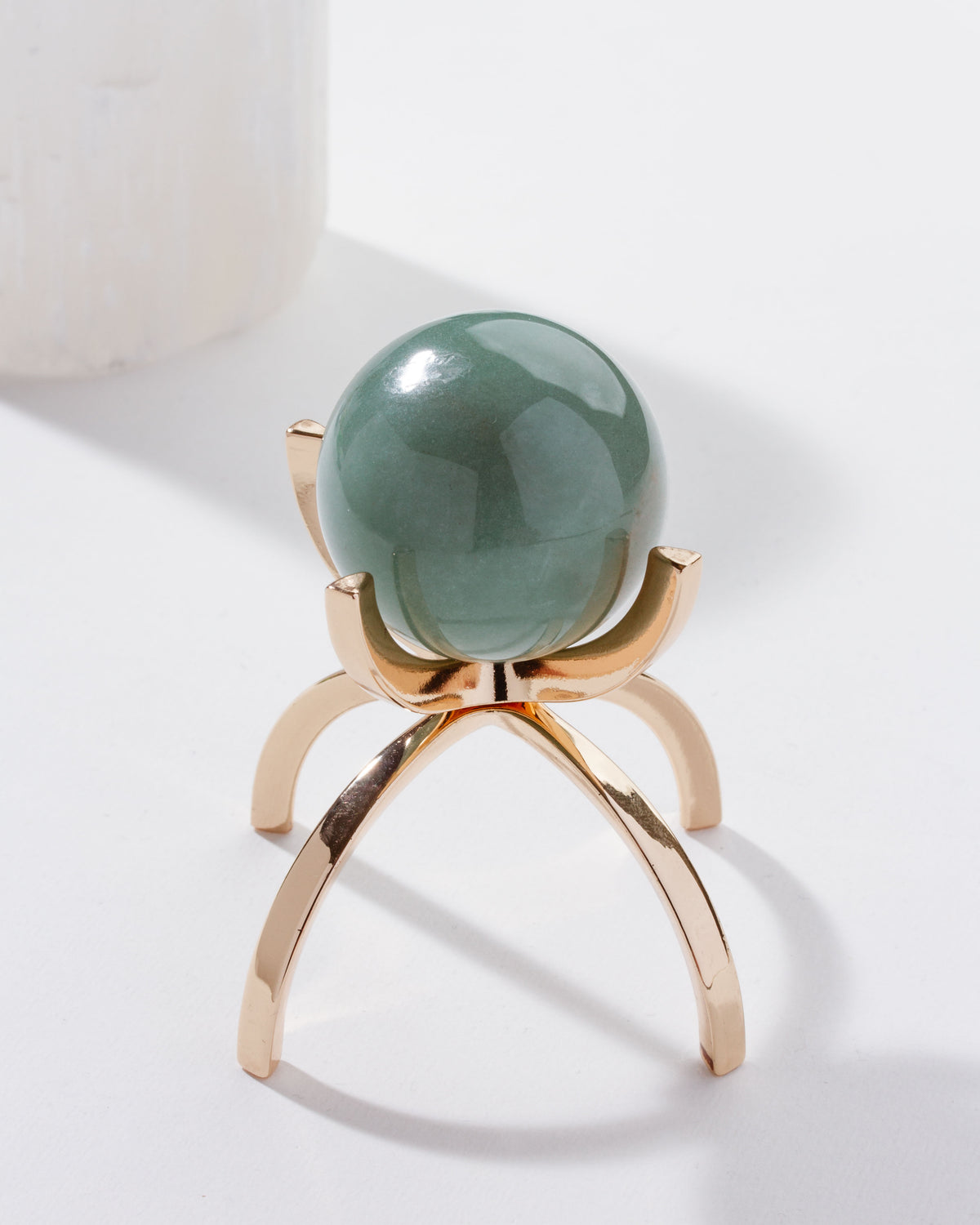 Eye Of the Beholder Gemstone Sphere On Stand Set, with a Green Aventurine sphere on a gold stand.
