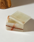 Open, natural Calcite jewelry box with visible banding.