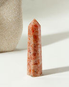 Sunstone Gemstone Tower is peach colored, with red and white accents.