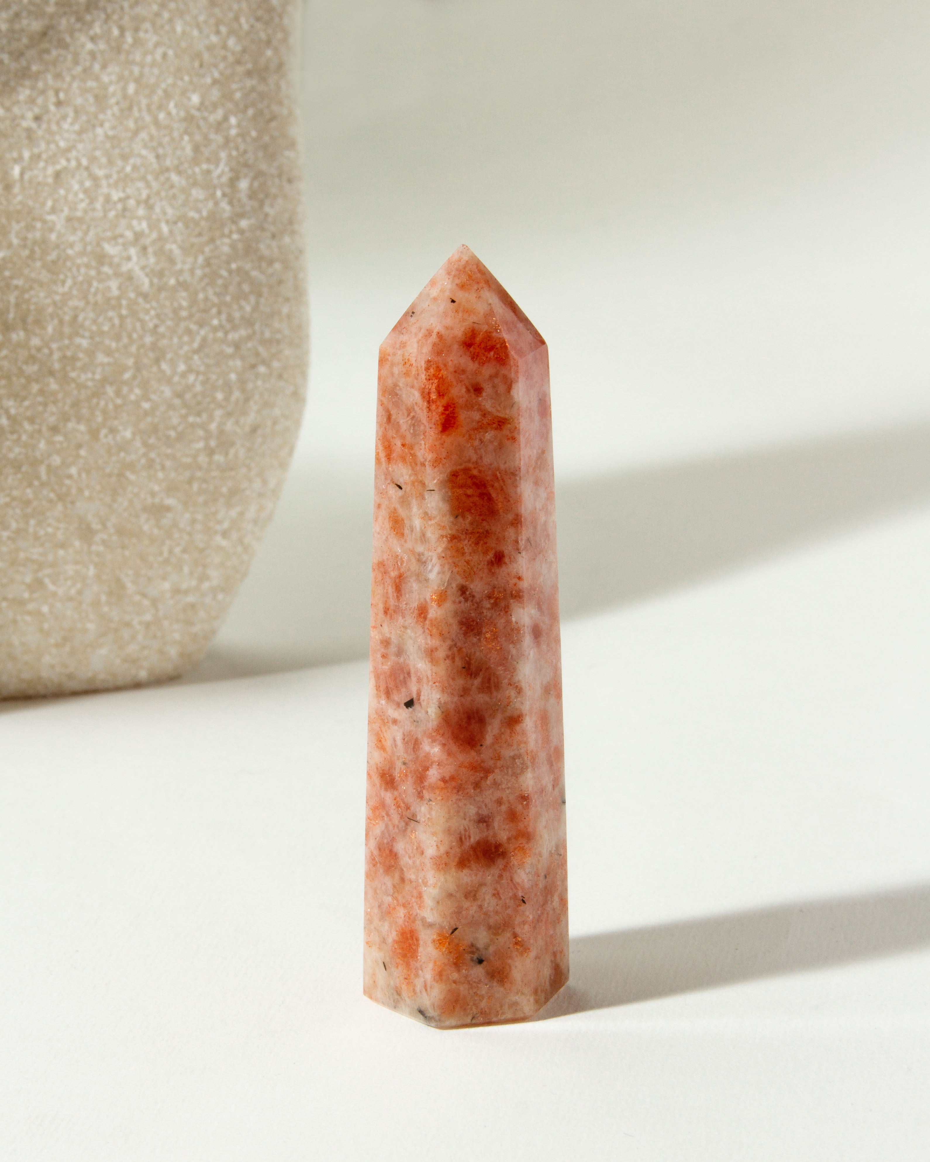 Sunstone Gemstone Tower is peach colored, with red and white accents.