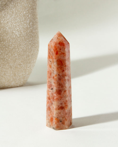 Sunstone Gemstone Tower is peach colored, with red and white accents.