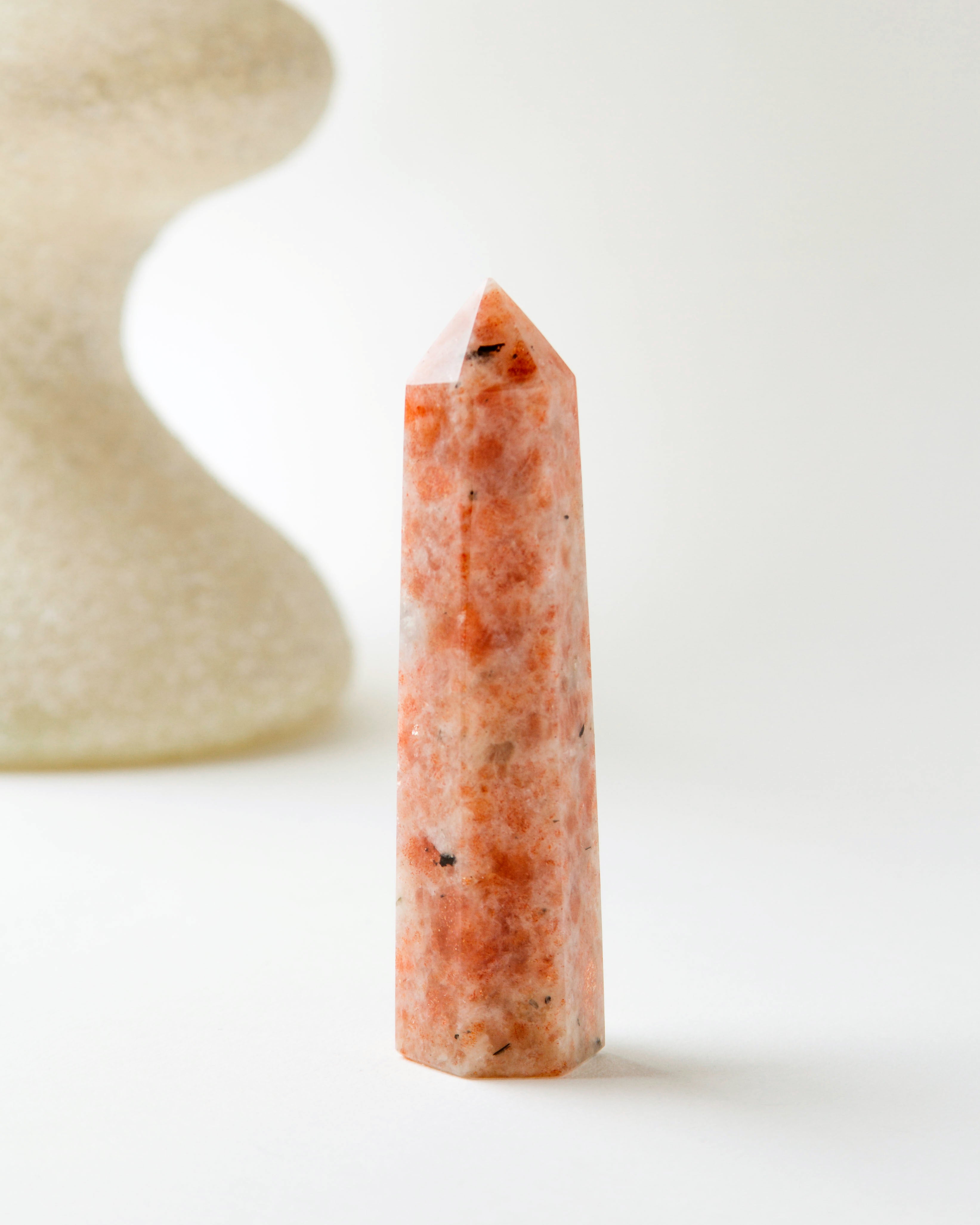 Sunstone Gemstone Tower with speckled orange coloring.