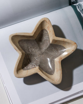 Star-shaped stone bowl on a light background