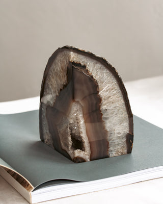 Geode on an open book with a neutral background