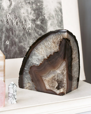 Geode crystal on a white surface with a blurred background