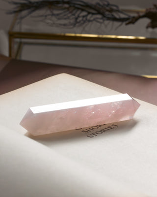 Crystal pyramid on a book.