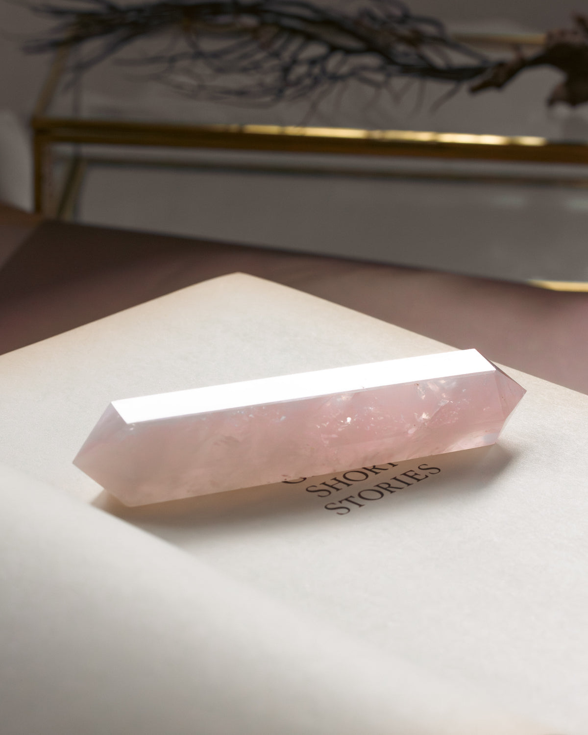 Crystal pyramid on a book.