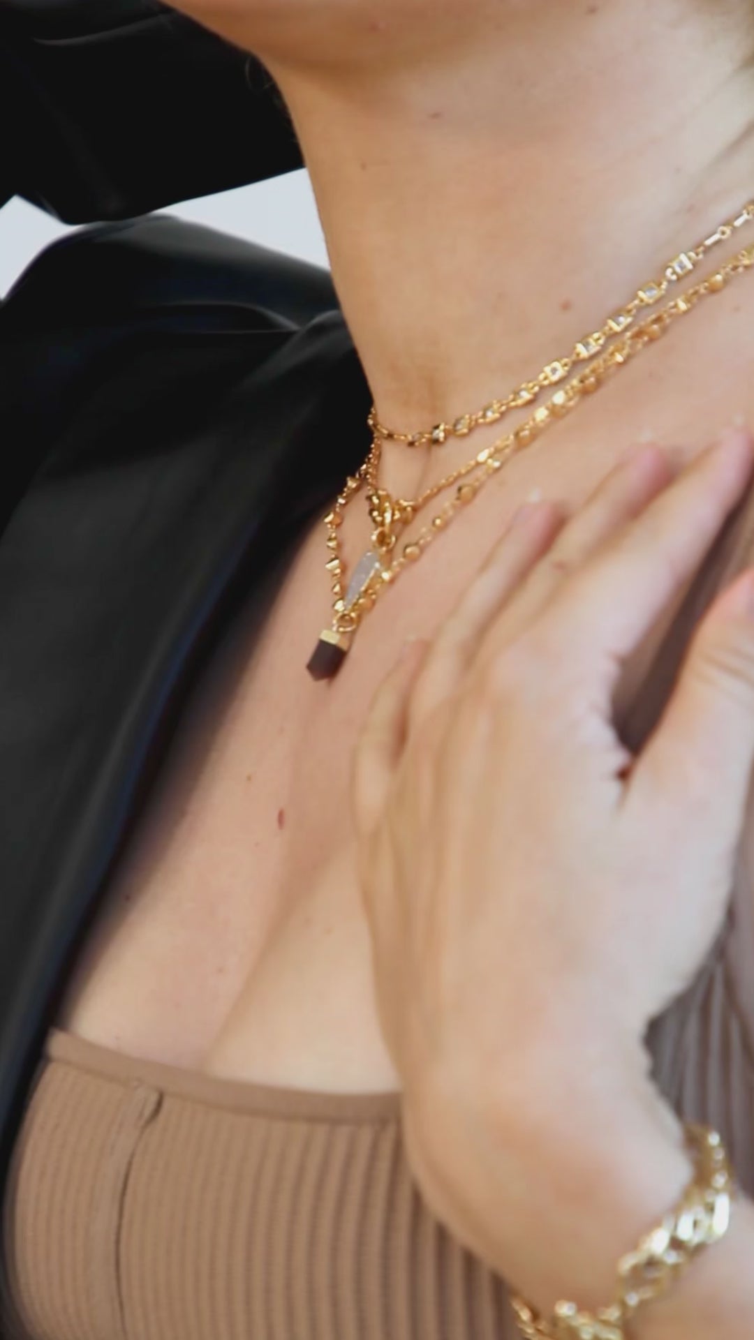 Woman wearing Straight to the Point Necklace in Coffee Moonstone with matching earrings. This video has no sound.