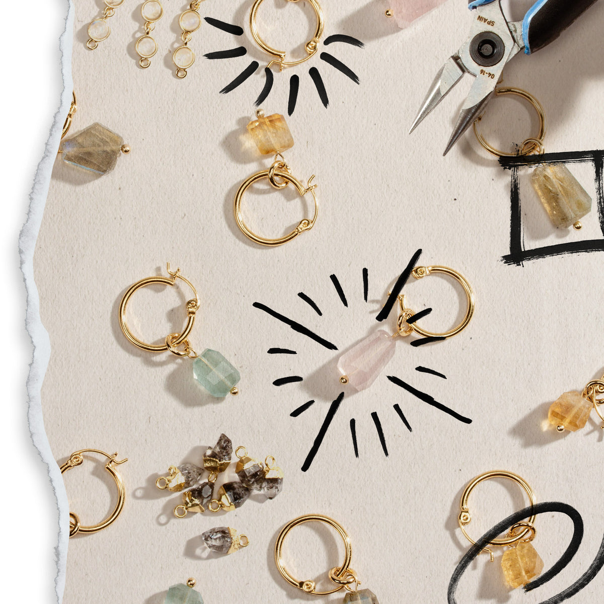 Decorative flat lay of many Luna Norte earrings including rose quartz, citrine, and quartz stones.