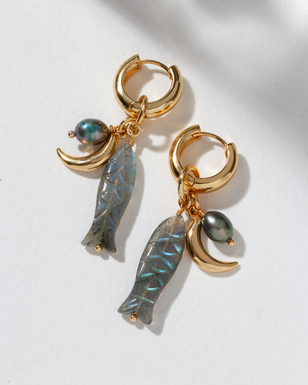 Tapas & Tides gold hoop with a blue-green labradorite charm