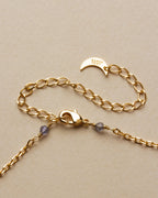 Gold chain and clasp with small kyanite stones of the Bohemian Long Medallion Necklace.