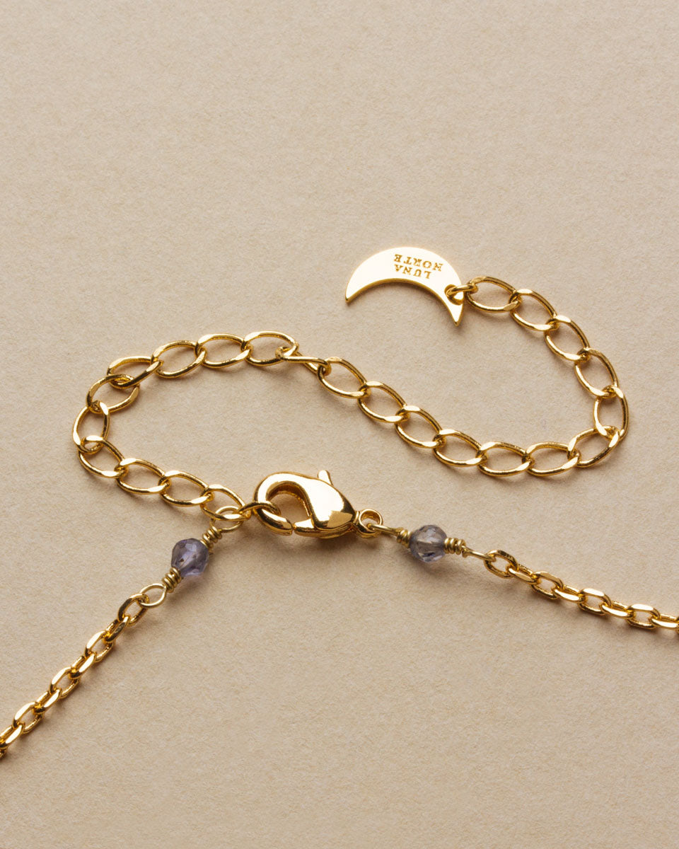 Gold chain and clasp with small kyanite stones of the Bohemian Long Medallion Necklace.