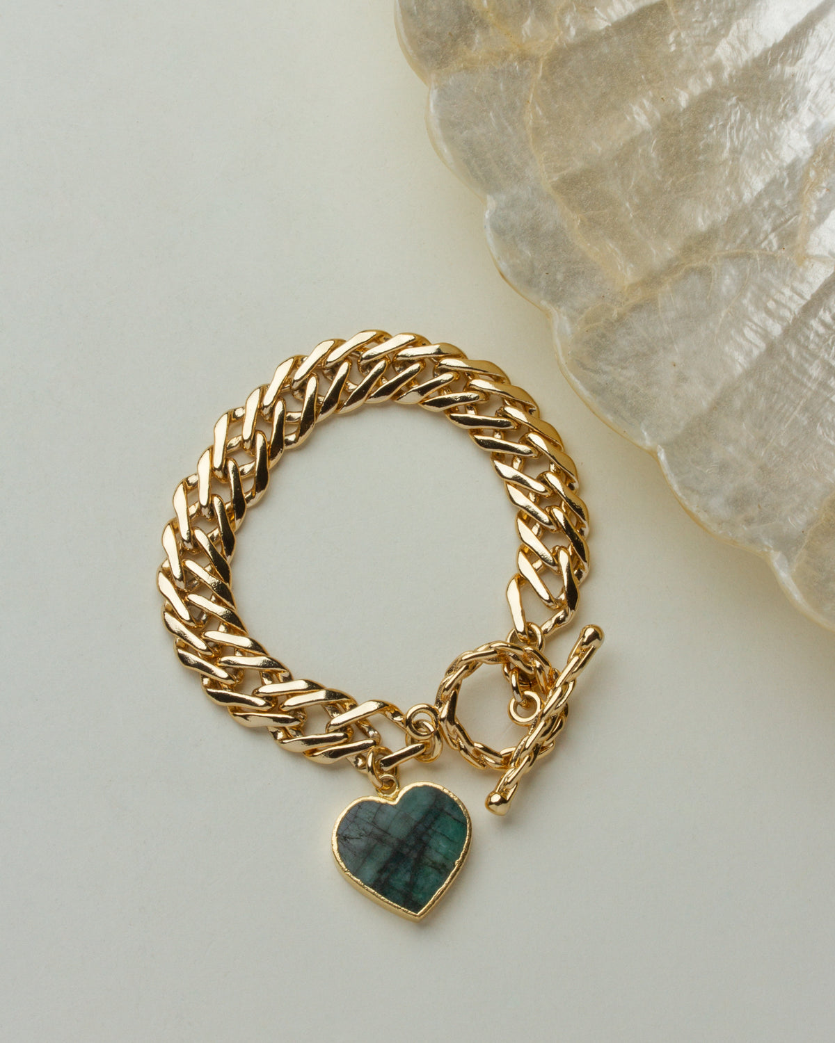 Gold Heart of Gold Toggle Bracelet with Emerald gemstone heart pendant.