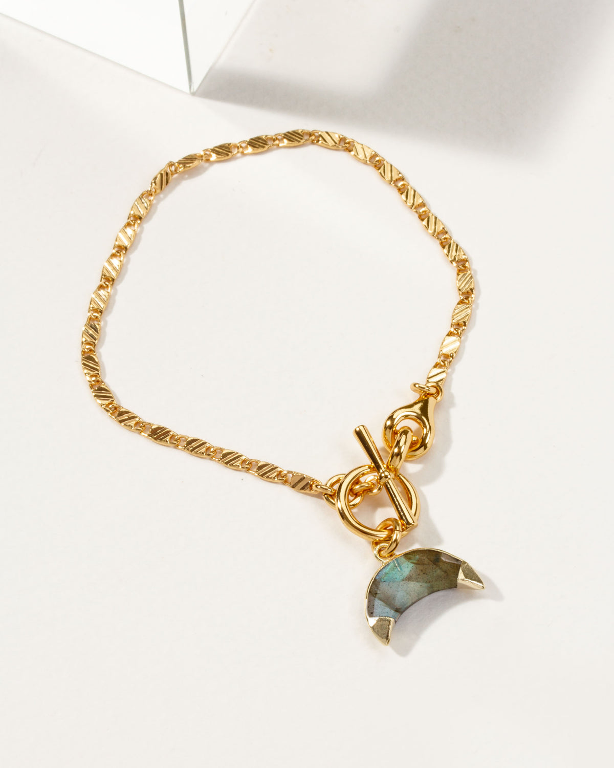 Gold Crescent Horn Toggle Bracelet with Labradorite gemstone.