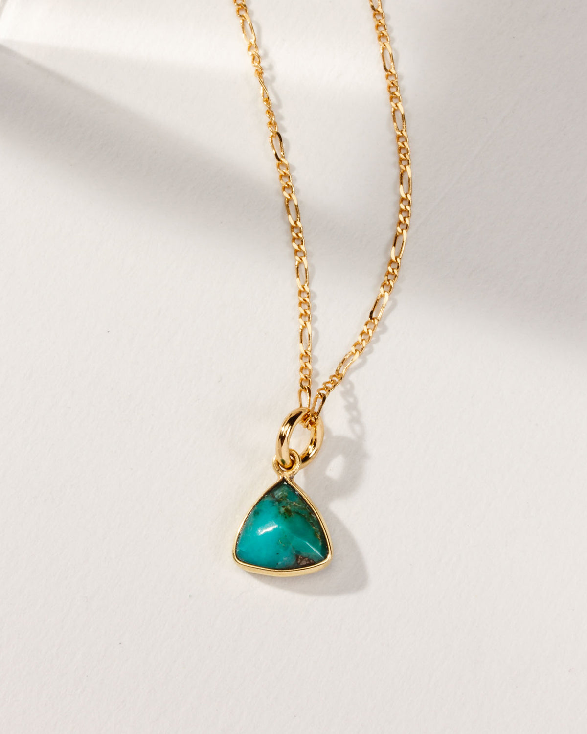 Detail of triangular turquoise pendant necklace