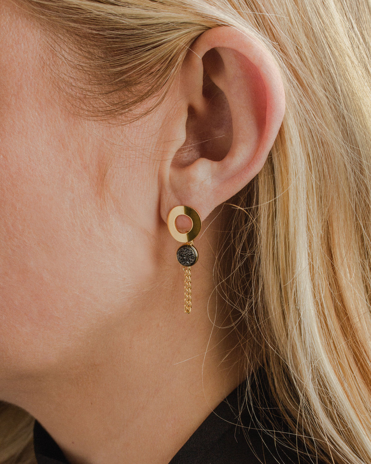 Close up of Ecliptic Druzy Post Earring with Black Druzy Quartz and gold chain.