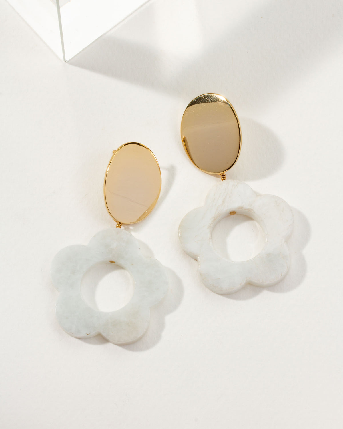 Oops-A-Daisy earrings featuring Moonstone gemstones and a gold post.