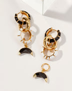 Gold hoop earrings with black and white enamel links and Onyx crescent moon charms.