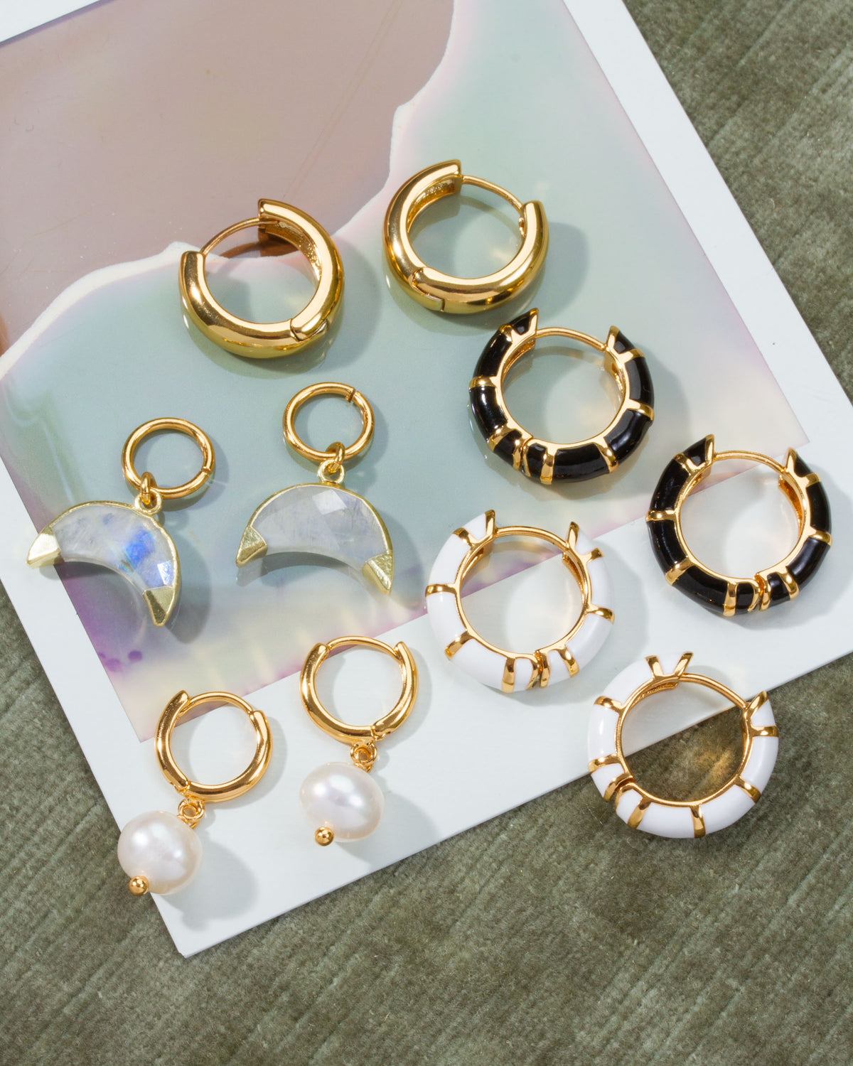 Jump Through interchangeable hoops in gold, pearl, moonstone, black, and white styles