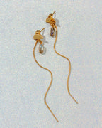 Two gold Ethereal Post Threader Earrings with a translucent marquise gemstone