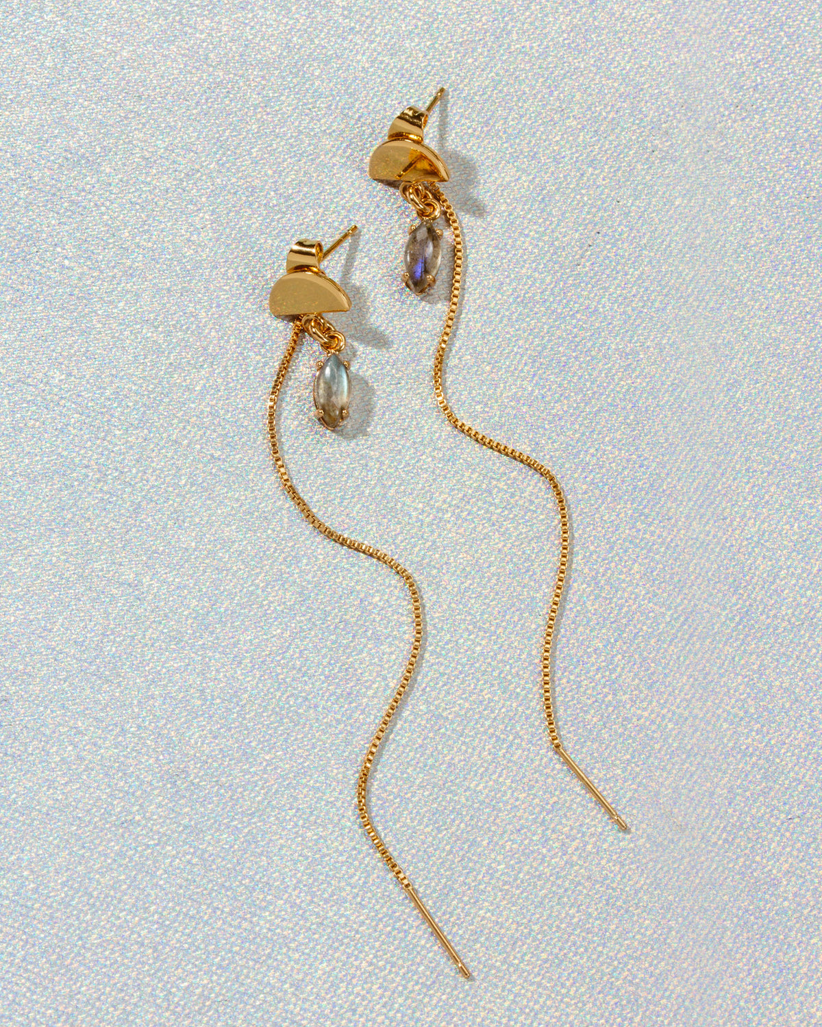 Two gold Ethereal Post Threader Earrings with a translucent marquise gemstone
