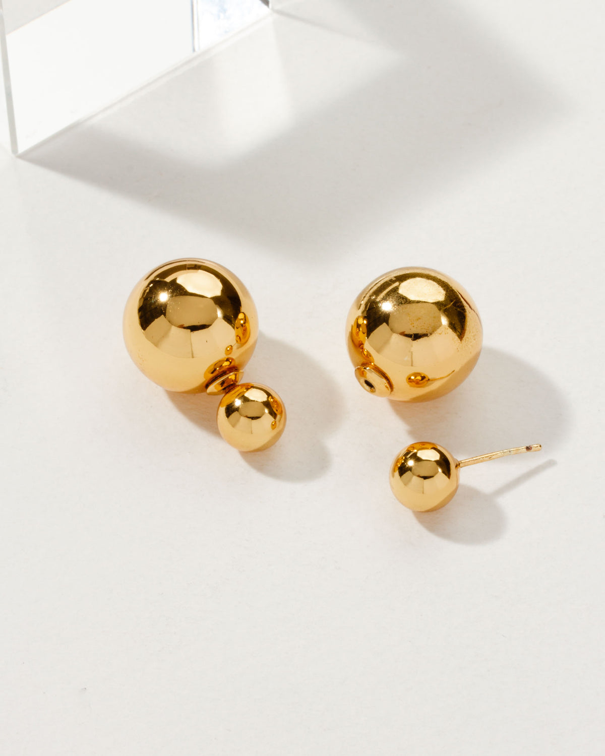 Orb Front Back Earring Gold featuring the front posts, backings, and a modern gold sphere design.