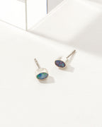 Oval Blue Wave Opal earrings with a sterling silver bezel.