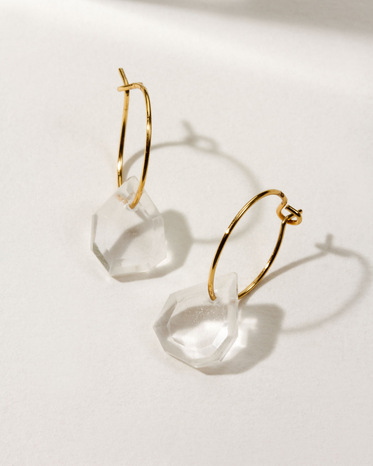 Two Geometry Mini Hoops with Clear Quartz stones and gold-plated silver hoops