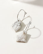 Hoop earrings with faceted Howlite stones and Sterling Silver hardware.