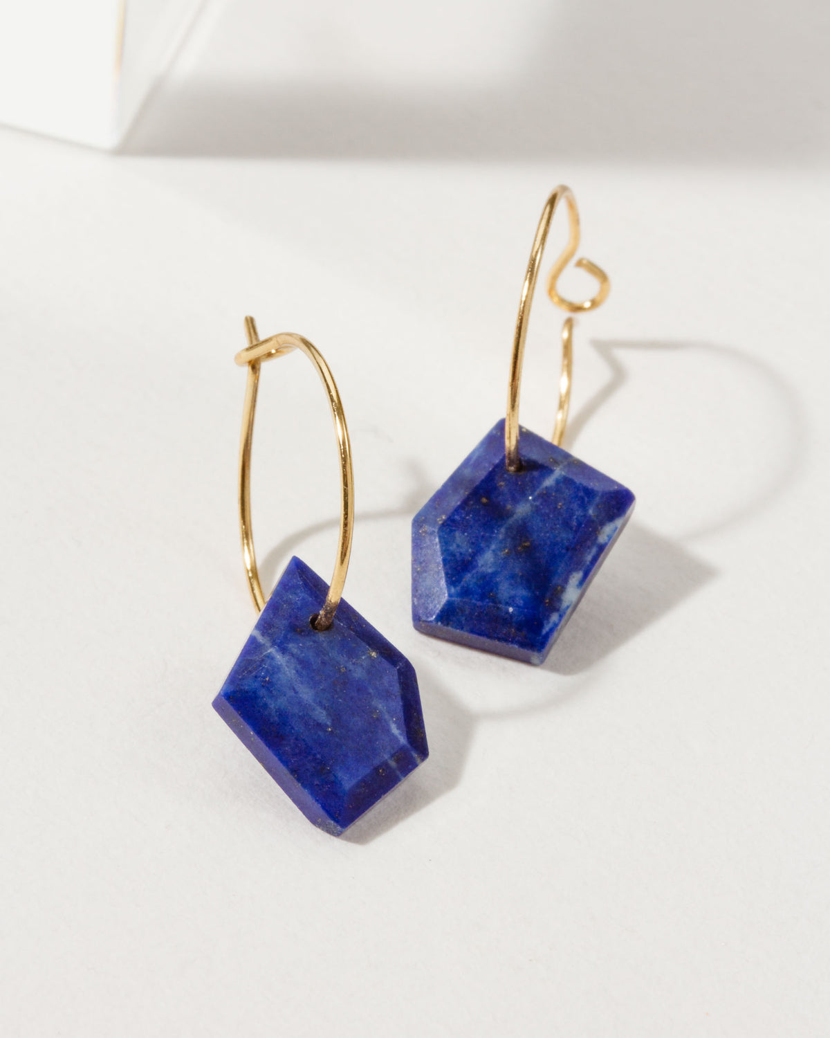 Pair of Geometry Mini Hoops with Lapis Lazuli stones and 14k gold plated sterling silver hoops.