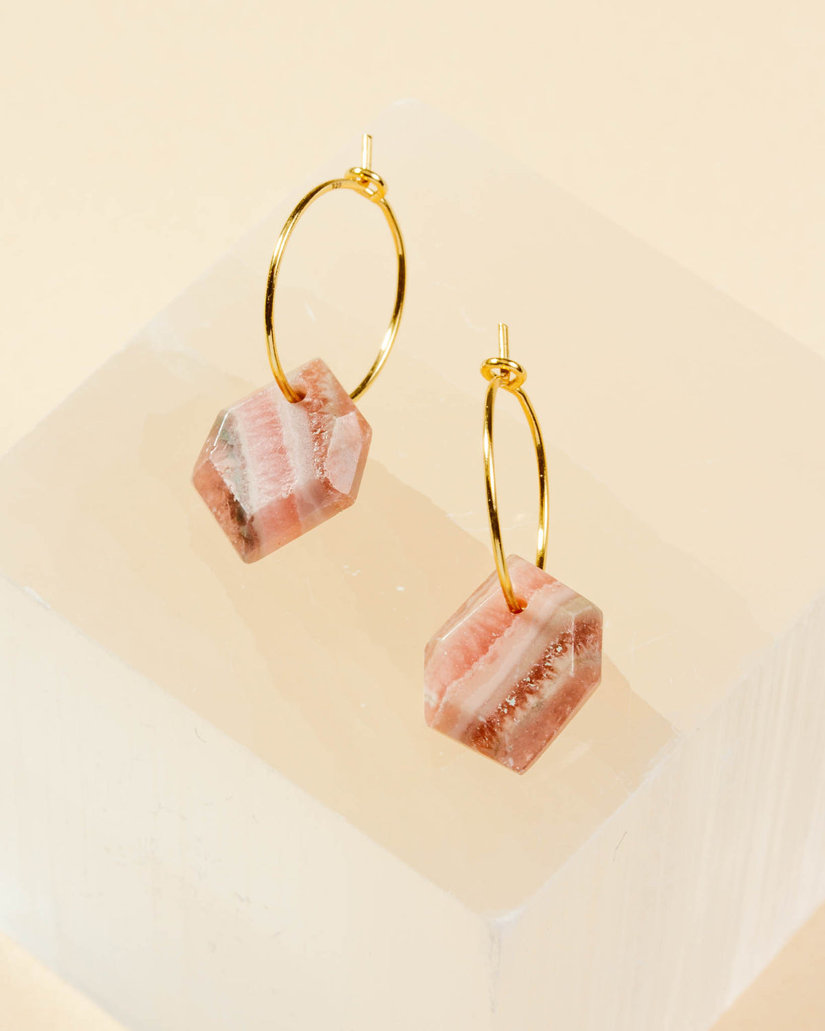 Geometry Mini Hoops in Rhodochrosite and gold-plated silver, with pink and white striped gemstones.