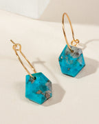 Geometry Mini Hoops in Turquoise with gold-plated silver hoops, with stone facets and hoop detail.